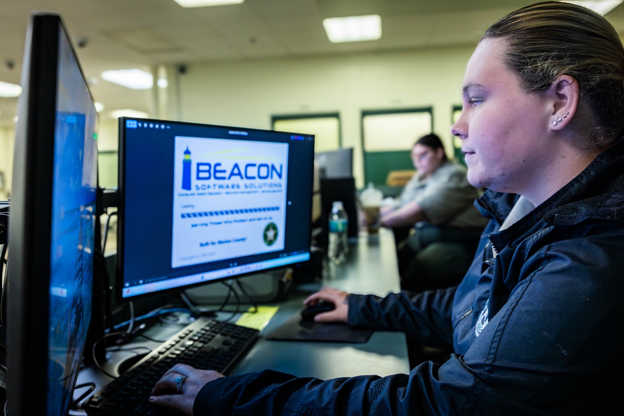 Officer working at a Beacon workstation