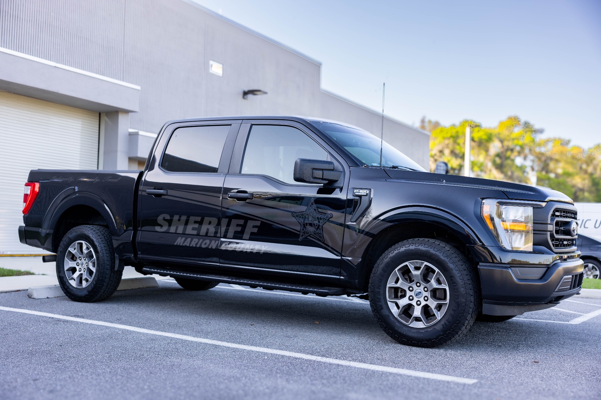 Black Marion County Sheriff truck parked outside facility